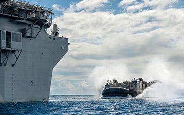 LCACS ship approaching a carrier out at sea